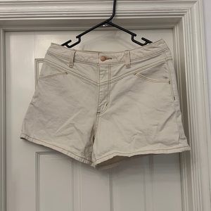 White jean shorts with light brown stitching